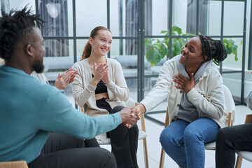 A group of different people are talking about something.