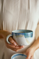 Female hands hold ceramic