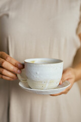 Female hands hold ceramic