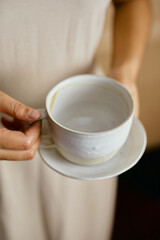 Female hands hold ceramic