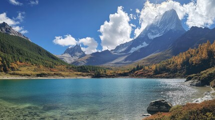 The holy Milk Lake in Yading Nature Reserve, with its turquoise waters set against a backdrop of dramatic mountain ranges.