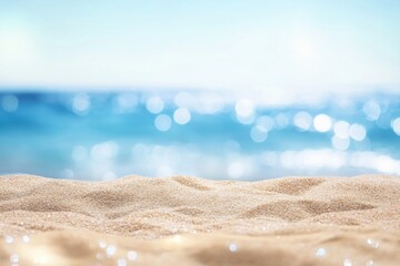 A serene beach with golden sand and a vibrant blue ocean, sparkling under the sunlight.