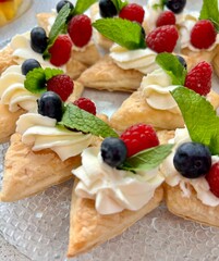 Canapes with curd cheese and fresh seasonal berries
