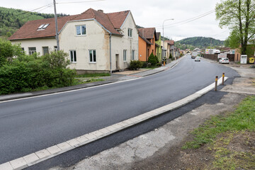 Asphalt road after laying asphalt. Black tarmac rebuilding. Roads in rural areas. 