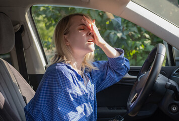 Stressed woman drive car feeling sad and shocked. Caucasian blond girl tired and feeling frustrated.