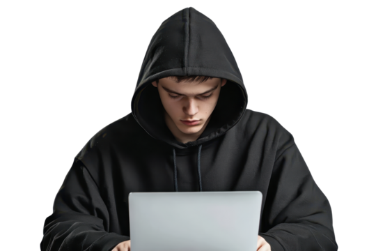 Young person in a black hoodie intensely working on a laptop. Perfect for cybersecurity or hacker themes, and technology concepts.