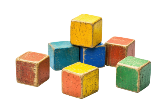 Close-up of colorful vintage wooden toy blocks arranged in a playful stack, creating a nostalgic and charming childhood aesthetic.