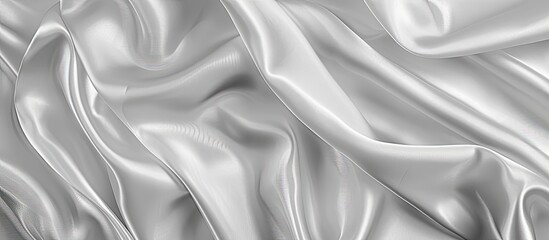 Obraz premium Gray satin fabric waves ideal as background or wallpaper with top view. White silk displaying lovely waves suitable as copy space image.