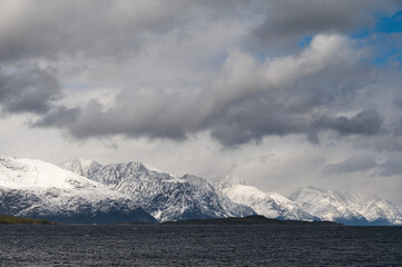 snowy landscape with snow-covered mountains along the road from Alta to Tromsoe, Norway