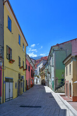 A narrow street between the old houses of Scapoli in Molise, Italy.
