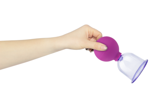 massage vacuum jar in hand, outstretched hand with massage vacuum jar isolated from background