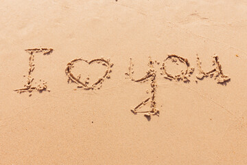 The inscription I love you on the seashore with palm trees