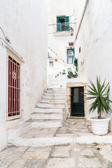 Characteristic narrow streets in the historic center of Ostuni, white city in Puglia, province of Brindisi, Italy