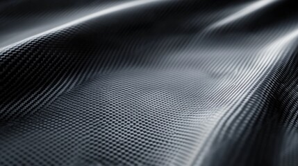 Close-up of carbon fiber texture, illustrating its sleek, durable material quality.