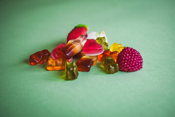 colorful candies on a green surface