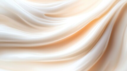 Obraz premium A soft, flowing fabric texture in shades of cream, perfect for backgrounds or design projects requiring elegance and softness.