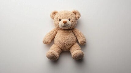 Obraz premium Teddy bear sitting alone with a blue background