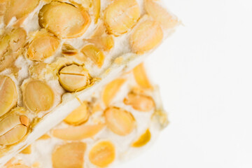 isolate tempeh wrapped on green banana leaf