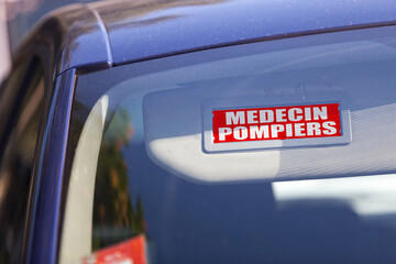 Obraz premium French Doctor Firefighters - Car sun visor