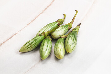 Small organic young green eggplant