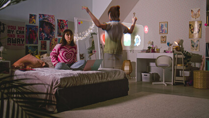 Teen girl chats with 3D animated avatar in cyberspace AI chat app sitting on bed with laptop. Futuristic VFX animation of virtual reality holographic character. AI friend technology. Augmented reality