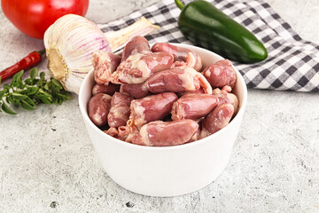 Fresh raw chicken hearts in the bowl
