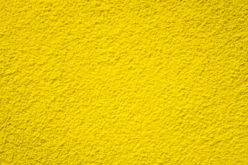 Yellow textured surface, yellow wall backdrop