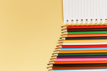 Fototapeta premium Back to school concept with variety of office and school supplies on yellow background. 