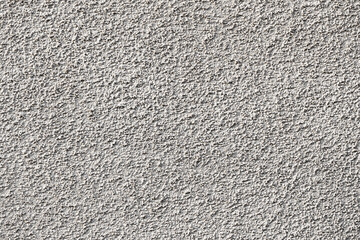 Gray concrete wall texture with rough stone pattern, grainy grunge details, distressed surface, and dusty effect. Architectural background. Abstract design project backdrop.