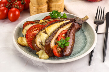 Baked tomato with mozzarella and tomato