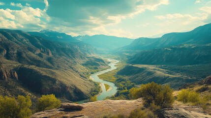 Obraz premium Majestic Mountain Range with Serene River Flow