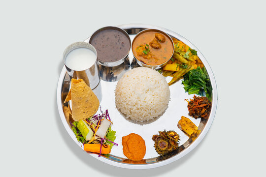 Nepali Meal of Daal Bhaat Tarkari Thakali Thali  Meat Rice vegetables and pickle dhido meal dinner or lunch