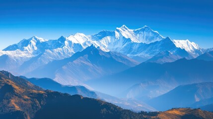 Naklejka premium Majestic Snow-Capped Mountain Peaks Against Clear Blue Sky