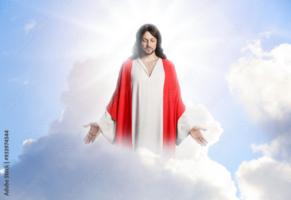 Wall mural jesus christ in sunlight among clouds in sky