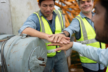 Hand touching team engineers man worker checking machine and use tablet computer with spare crane background	