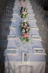 Chairs and table decorated with candles and flower. Wedding Day