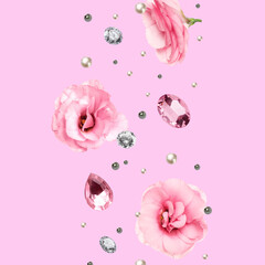 Gemstones, pearls and flowers in air on pink background