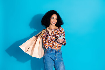 Photo of attractive woman wear stylish clothes online order purchase empty space isolated on blue...