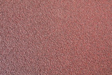 Stone background. Red asphalt. Surface for cycle paths.