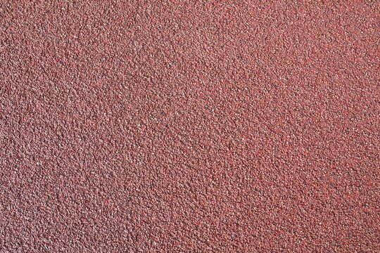 Stone background. Red asphalt. Surface for cycle paths.