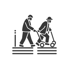 A man assisting an elderly person with a walker on a sidewalk