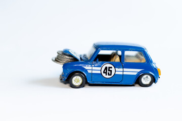 Toy car and coins. Rising prices for old cars in Ukraine