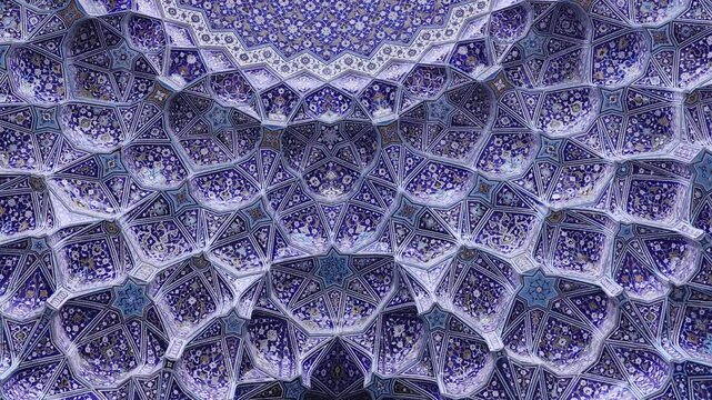 Ceiling at Imam Mosque, arch at the entrance, Naghsh-e Jahan Square, Isfahan, Iran. Beautiful oldest iranian mosque interior design. Unique mosaics and ornaments. A masterpiece of Persian architecture