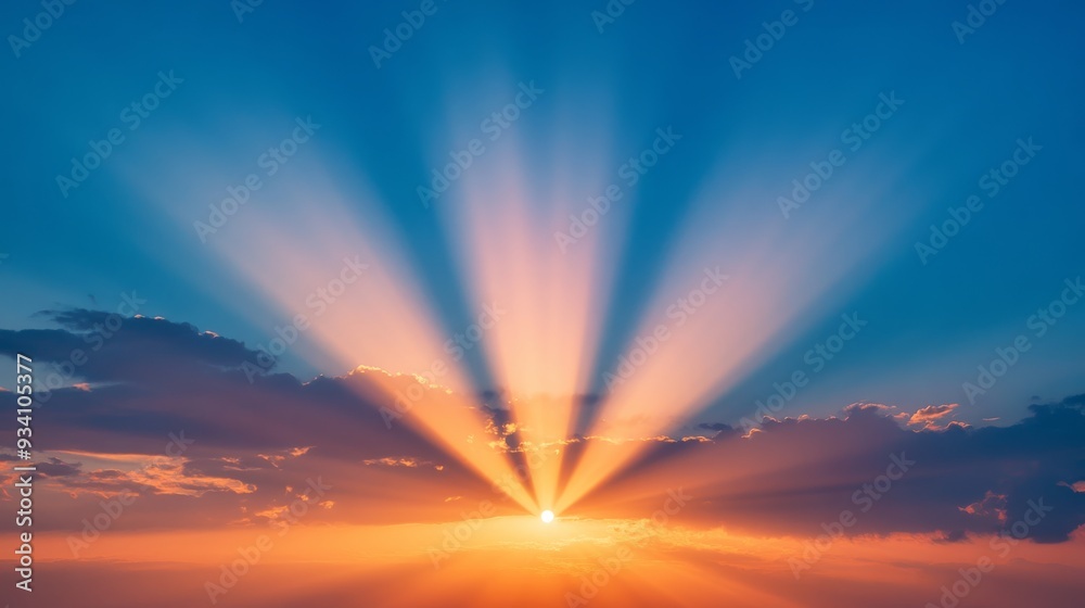 Poster brilliant rays of the setting sun illuminating a dramatic sky with gradient colors from deep blue to