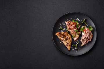 Variation of several toasts or bruschetta with prosciutto, mushrooms and veal
