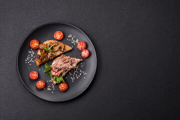 Variation of several toasts or bruschetta with prosciutto, mushrooms and veal