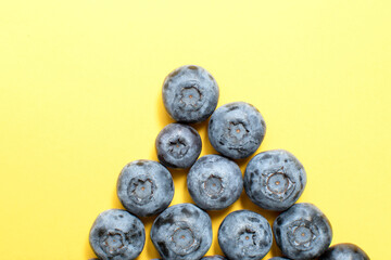 Fresh blueberry on yellow background	