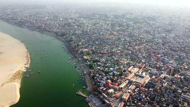  Aerial view of varanasi or banaras city and ancient architecture on the banks of river ganges .Varanasi ghats on the banks of the sacred ganges river at sunrise in varanasi, uttar pradesh, India.