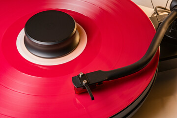 Coloured vinyl record spinning on a hifi turntable
