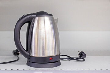 electric metal kettle shutdowns. Blackout, electricity savings. Everyday life. economic crisis